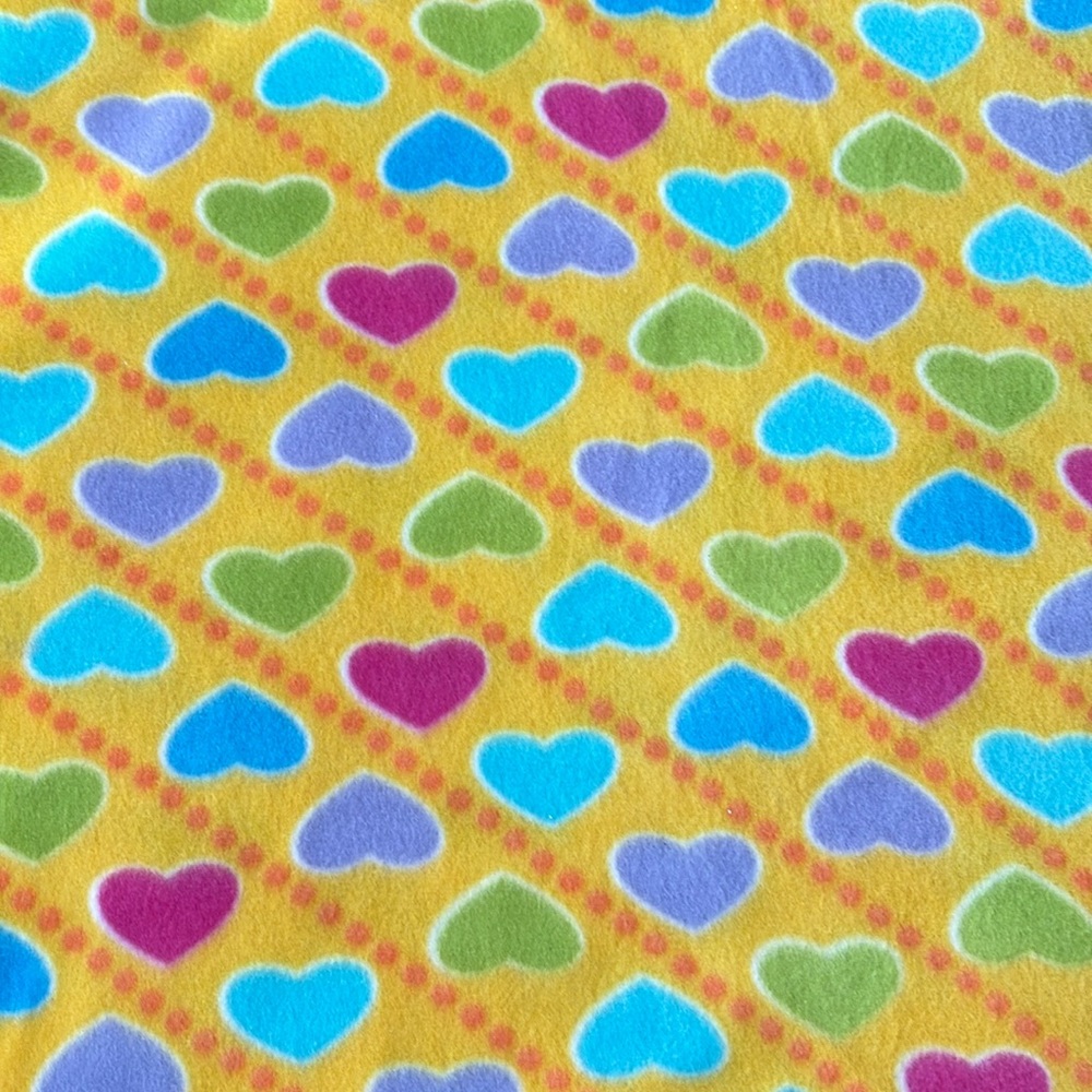 1 yard 18 inches Yellow with bright colored hearts fleece fabric.